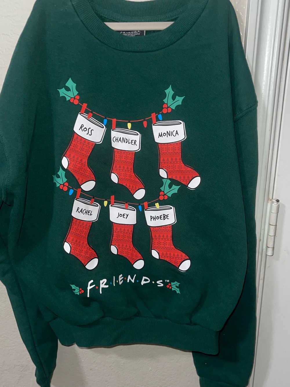 FRIENDS Dark Green Holiday Sweatshirt with Red Stocking Graphics